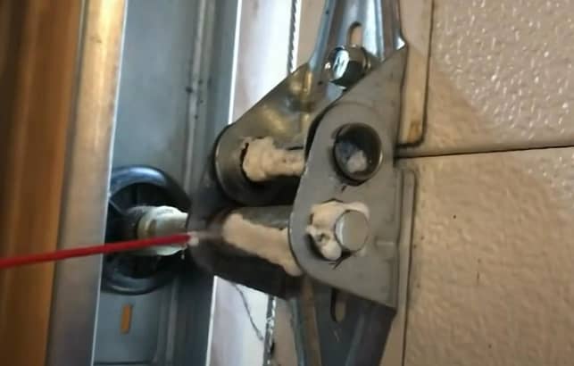 lubing garage door rollers helps reduce noise